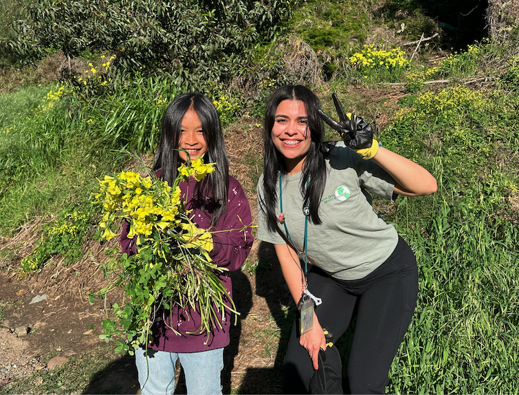 AmeriCorps Discovery Fellow and student smile during a program. 